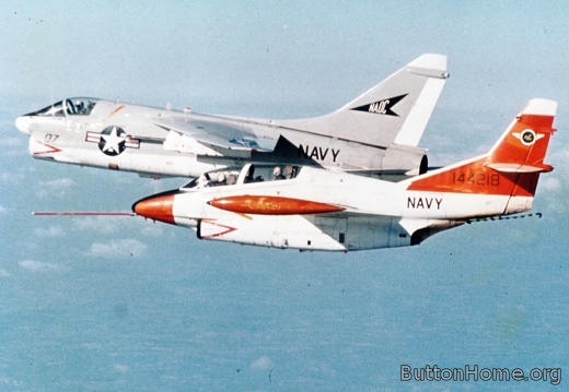 NADC T-2C flying alongside NADC A-7