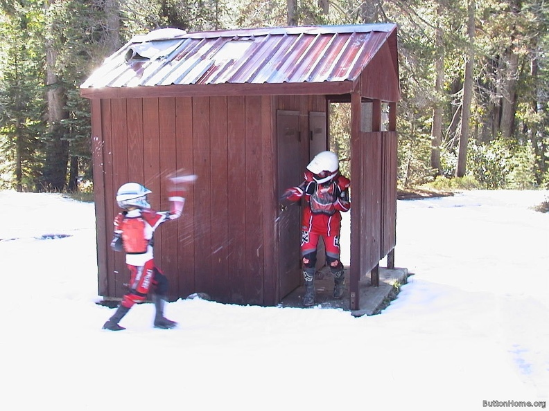 02_Bryan_and_Briana_throw_snowballs_near_the_outhouse.jpg